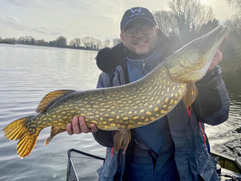 fisherman showing fish